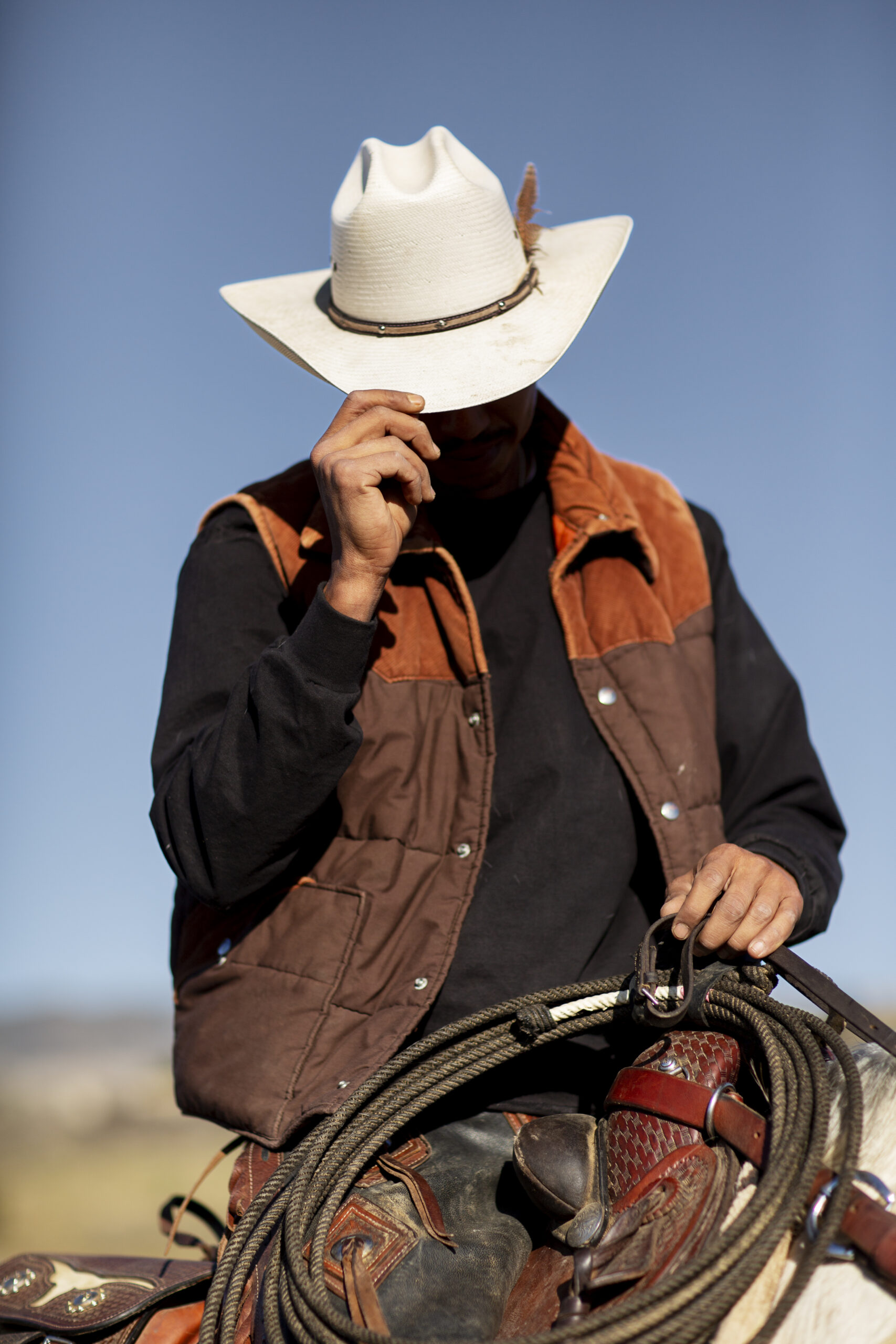 cowboy-silhouette-with-horse-against-warm-light-scaled